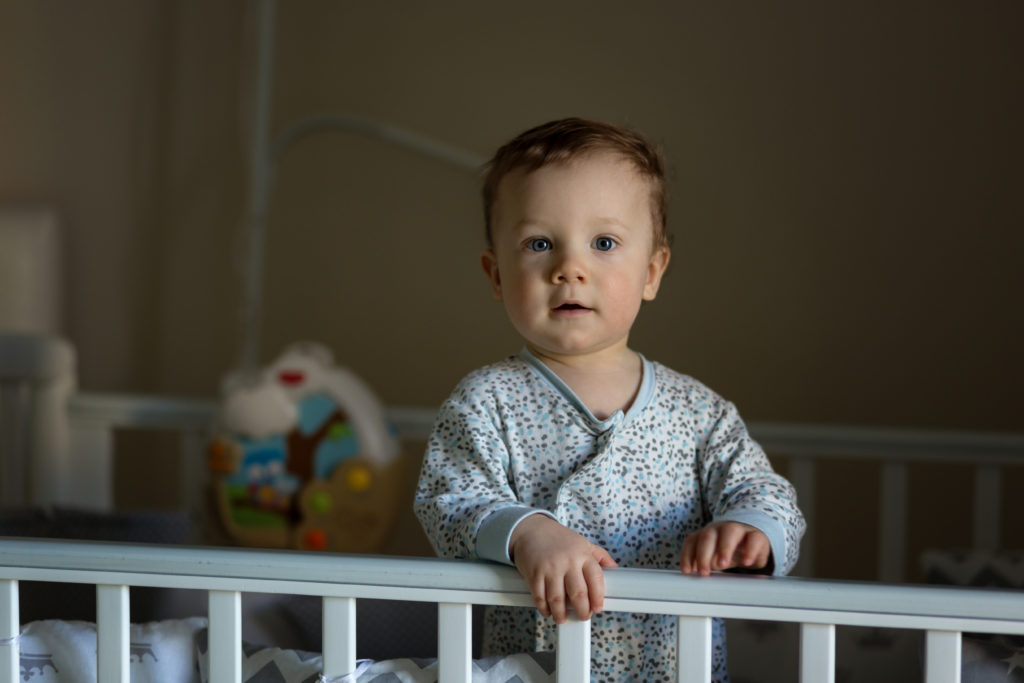 standing up in the cot
